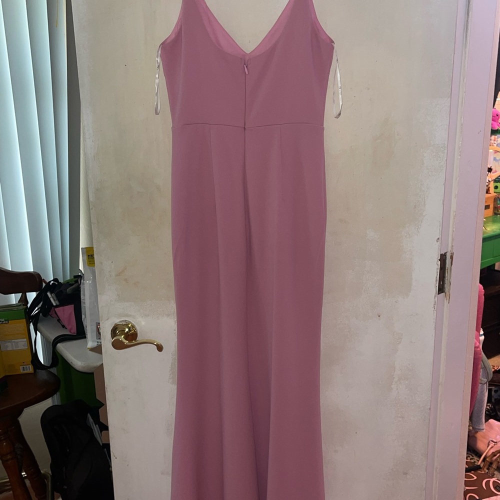 Long light pink gown. Zips from the back with adjustable straps.